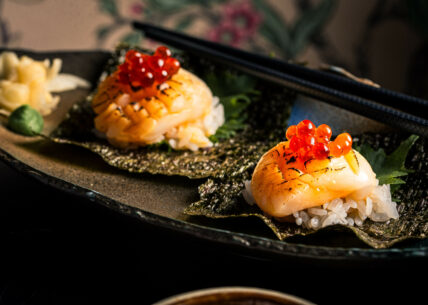 Kaiseki-inspired open style temaki - scallop Kaiseki-inspired open style temaki for hand-rolling. Seasoned sushi rice on a nori square with a range of toppings. This one is filled with scallop, ginger, soy & ikura.