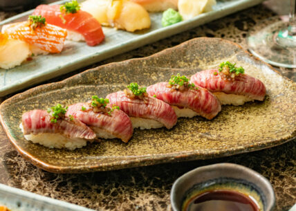 wagyu truffle nigiri wagyu truffle nigiri 5 piece nigiri with lightly seared wagyu sirloin, topped with truffle mayo, soy wasabi, tempura flakes & chives