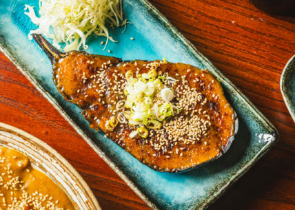 Nasu dengaku nasu dengaku - vegan. charred aubergine with a rich, caramelised miso glaze. finished with sesame & spring onion