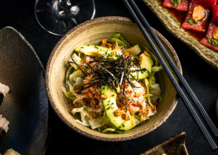 kani salad - crab salad. kani salad - crab salad. red snow crab, lettuce, avocado & tobiko with a sweet & sour tosazu jelly dressing, topped with chives & crispy onion